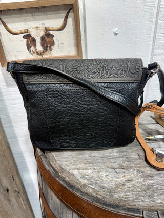 Back of Trinity Ranch Black Hair-On Hide Crossbody Bag with Concho Pockets