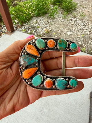 Handcrafted German Silver belt buckle featuring Orange Spiny Oyster and Kingman Turquoise. Bold Southwestern style and authentic Western charm
