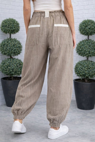 Back of Taupe Pinstripe Cargo Jogger Pants with Drawstring Waist & Tie Pockets
