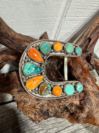 Handcrafted German Silver belt buckle featuring Orange Spiny Oyster and Kingman Turquoise. Bold Southwestern style and authentic Western charm