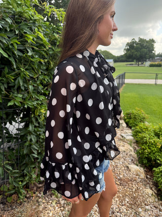 Side view Black & White Polka Dot Chiffon Bow Tie Blouse | Flowy Ruffle High Low Hem Top