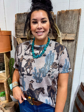 Dust It Off Cowboy Graphic Tee – Western Rodeo Cactus Print Top for Women